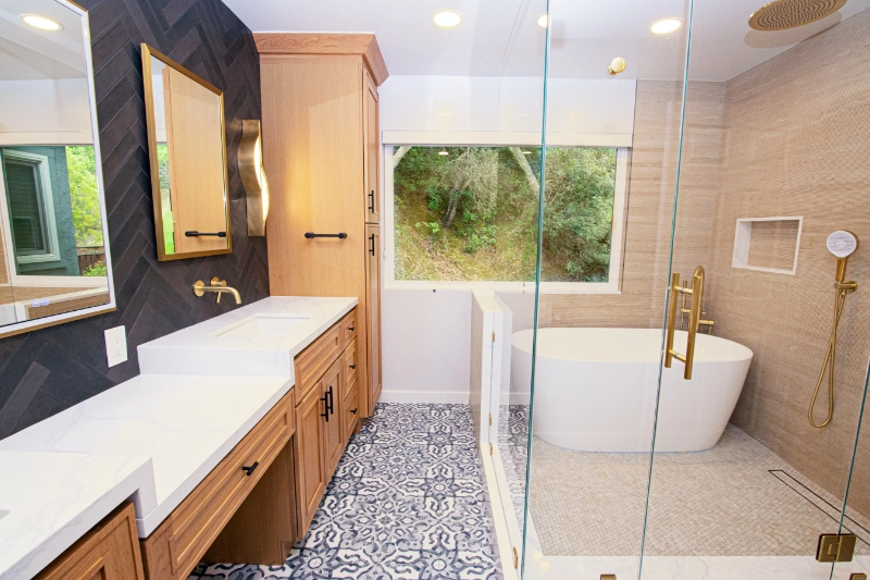 Modern bathroom with a double sink vanity, a large mirror, a glass-enclosed shower with a rain showerhead, a freestanding bathtub, and patterned floor tiles.