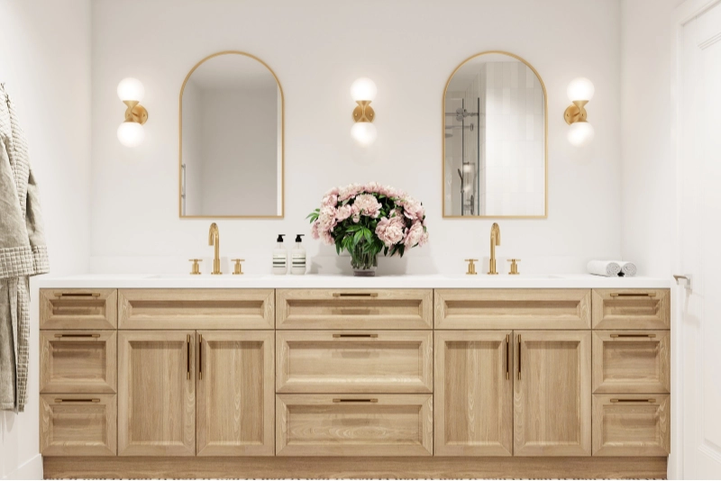 A luxury home remodel features a bathroom with a wooden double-sink vanity, two mirrors, and wall-mounted lights.